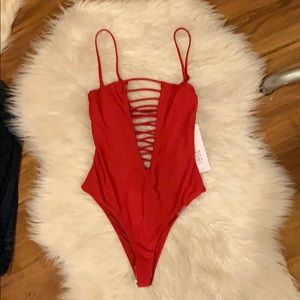 Red strappy one-piece swimsuit